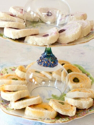 Rolled Tea Sandwiches on tiered tea plates.