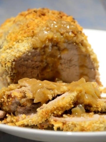Ginger Crusted Pork Roast With Maple Dijon Sauce on a platter.
