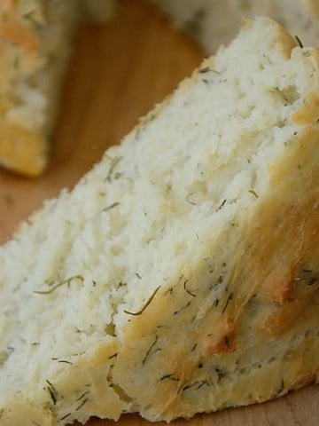 A wedge of no knead dill bread.
