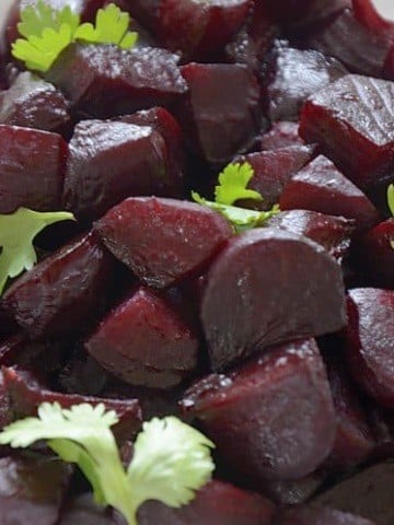 Close up of Roasted Balsamic Beets with cilantro garnish.