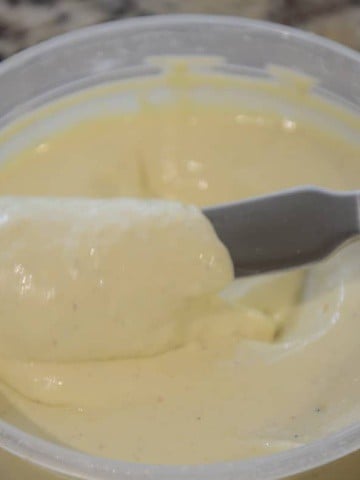 Silky, yellow corn mayonnaise in a tub.