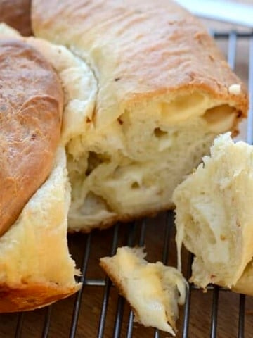 Round loaf stuffed with melted cheese and red pepper flakes.